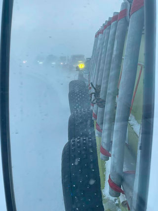 Green leads the column in a blizzard to Cambridge Bay.